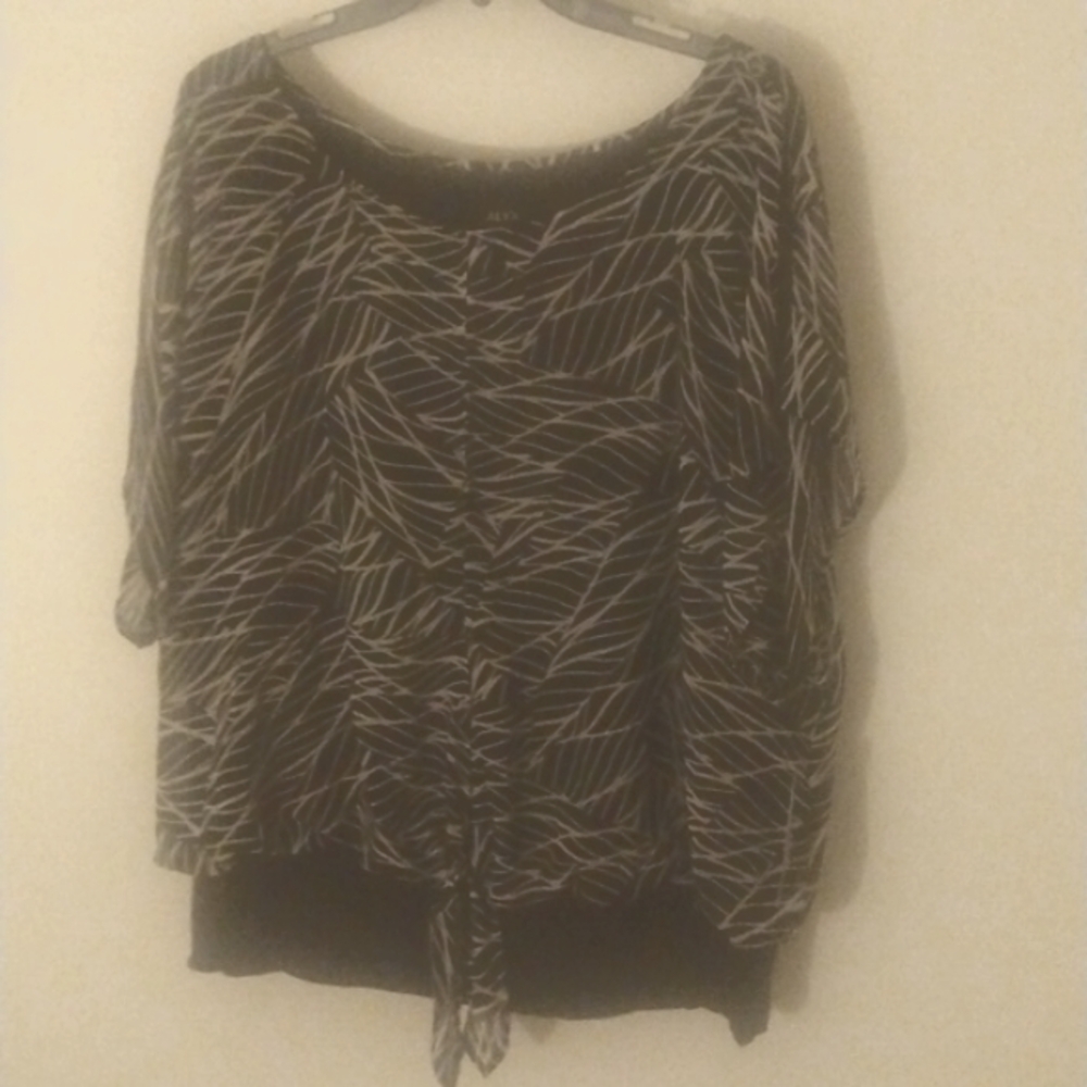 Black and white ALYX blouse open slit in front and back of blouse.